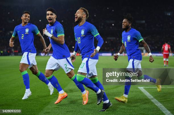 Neymar of Brazil celebrates after scoring their sides third goal from the penalty spot during the International Friendly match between Brazil and...