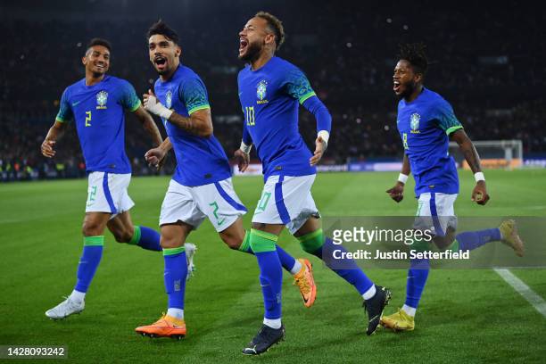 Neymar of Brazil celebrates after scoring their sides third goal from the penalty spot during the International Friendly match between Brazil and...