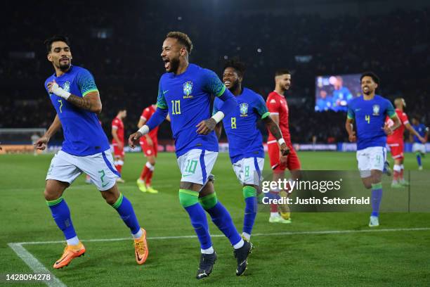 Neymar of Brazil celebrates after scoring their sides third goal from the penalty spot during the International Friendly match between Brazil and...