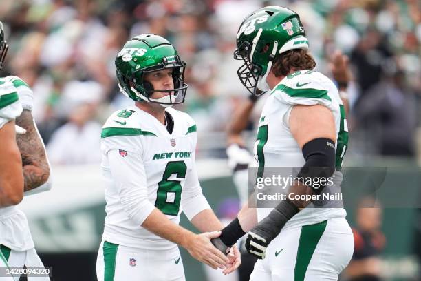 Greg Zuerlein of the New York Jets celebrates with Dan Feeney against the Cincinnati Bengals at MetLife Stadium on September 25, 2022 in East...