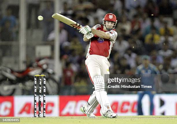 Kings XI Punjab batsman Shaun Marsh plays a shot after making half-century during IPL-5 cricket match played between Kings XI Punjab and Pune...
