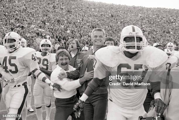 The Stanford Cardinal football team reacts during The Play in the last few seconds of the 85th Big Game against Cal played at Memorial Stadium in...