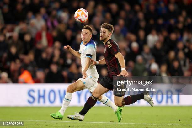 Luke Thomas of England battles for possession with Jan Thielmann of Germany during the International Friendly match between England U21 and Germany...