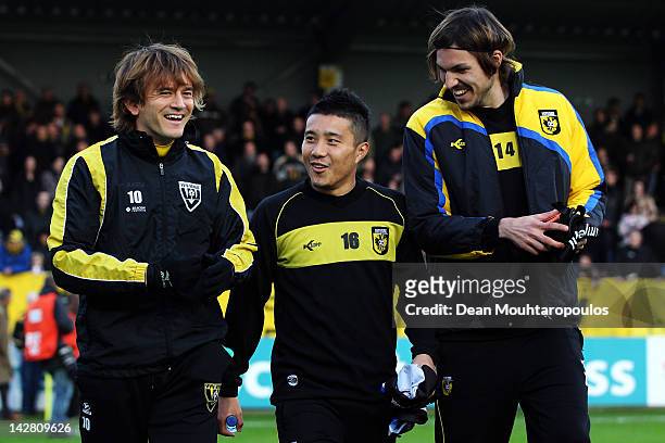Robert Cullen of VVV Venlo and Mike Havenaar and Michihiro Yasuda of Vitesse share a laugh prior to the Eredivisie match between VVV Venlo and...