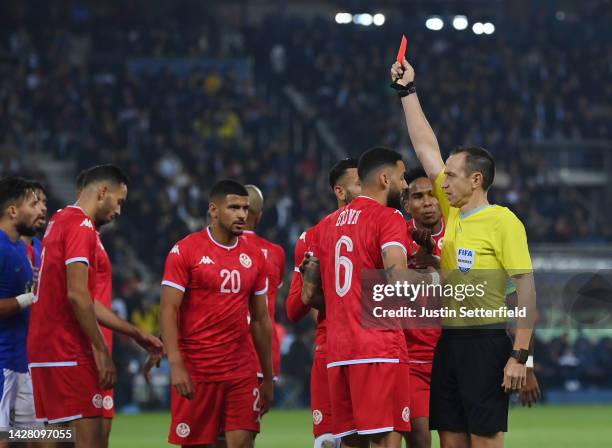 Dylan Bronn of Tunisia is shown a red card from match referee Ruddy Buquet during the International Friendly match between Brazil and Tunisia at Parc...