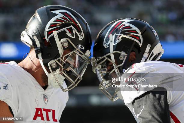 Marcus Mariota and Drake London of the Atlanta Falcons celebrate a touchdown during the third quarter against the Seattle Seahawksat Lumen Field on...