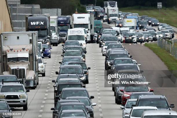 Heavy traffic moves slowly on I-4 East as residents evacuate the Gulf Coast of Florida in advance of the arrival of Hurricane Ian on September 27,...