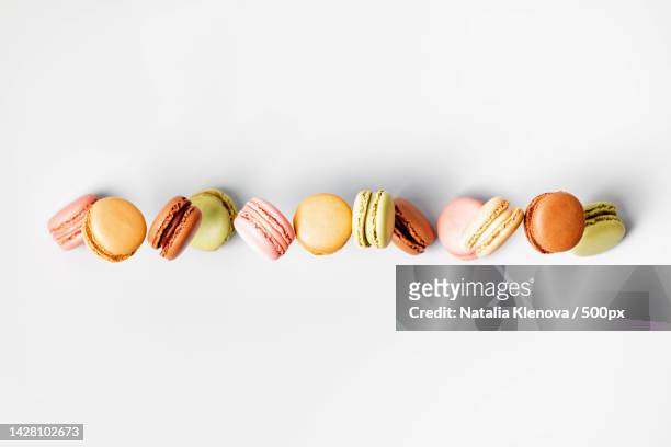 close-up of macaroons against white background - macaroon photos et images de collection