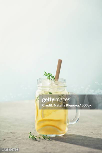 summer drink with lemon and rosemary - lemonade stock-fotos und bilder