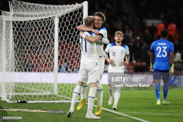 Conor Gallagher of England celebrates with team mate Anthony Gordon after scoring their sides second goal during the International Friendly match...