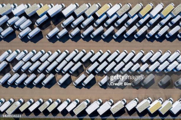 aerial view of white delivery vans - white warehouse stock pictures, royalty-free photos & images