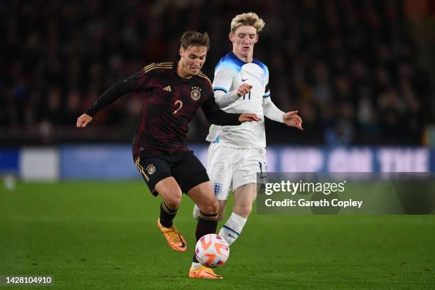 Kilian Fischer of Germany is challenged by Anthony Gordon of England during the International Friendly match between England U21 and Germany U21 at...