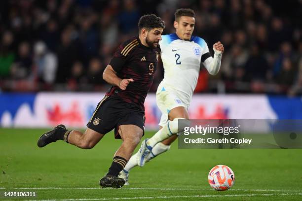 Reda Khadra of Germany runs with the ball whilst under pressure from Max Aarons of England during the International Friendly match between England...