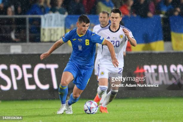 Ruslan Malinovskyi of Ukraine is challenged by Ryan Jack of Scotland during the UEFA Nations League League B Group 1 match between Ukraine and...