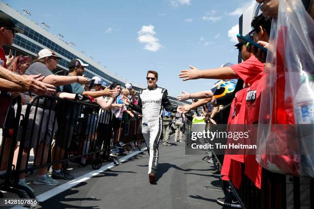 Landon Cassill, driver of the WearMe Chevrolet, greets fans during pre-race ceremonies prior to the NASCAR Cup Series Auto Trader EchoPark Automotive...