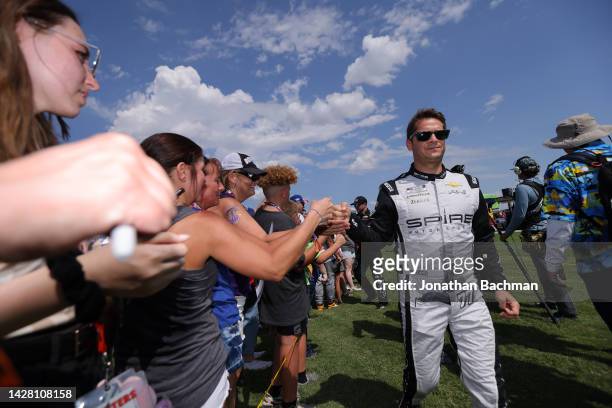 Landon Cassill, driver of the WearMe Chevrolet, greets fans during pre-race ceremonies prior to the NASCAR Cup Series Auto Trader EchoPark Automotive...