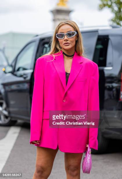 Guest wears pink blazer, two tone white pink bag, silver sunglasses outside Victoria/Tomas during Paris Fashion Week - Womenswear Spring/Summer 2023...