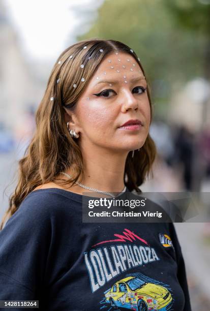 Amelie Stanescu wearing cropped blazer shirt, black belted varnished skirt, rhinestones make up outside Victoria/Tomas during Paris Fashion Week -...