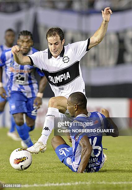 Footballer Oscar Bagui , of Ecuador’s Emelec, vies for the ball with Arnaldo Castorino of Paraguay's Olimpia during a Libertadores Cup match at the...