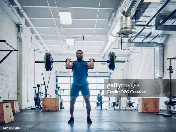 man cross training in a gym - barbell stock pictures, royalty-free photos & images