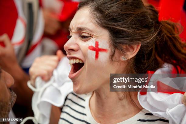 young english woman cheering for national team - england womens football stock pictures, royalty-free photos & images