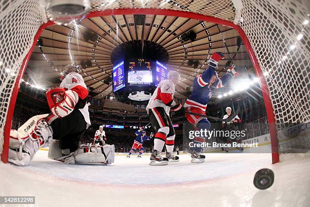 Derek Stepan of the New York Rangers celebrates after Ryan Callahan scored a goal in the first period against goalie Craig Anderson and Kyle Turris...