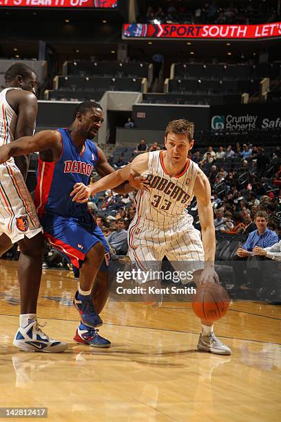 Matt Carroll of the Charlotte Bobcats drives against Will Bynum of the Detroit Pistons at the Time Warner Cable Arena on April 12, 2012 in Charlotte,...