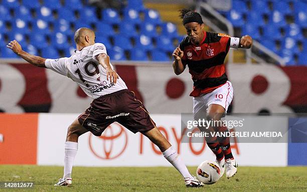 Brazilian Flamengo's player Ronaldinho Gaucho vies for the ball with Guido Pizarro of Argentina's Lanus during their Copa Libertadores football match...