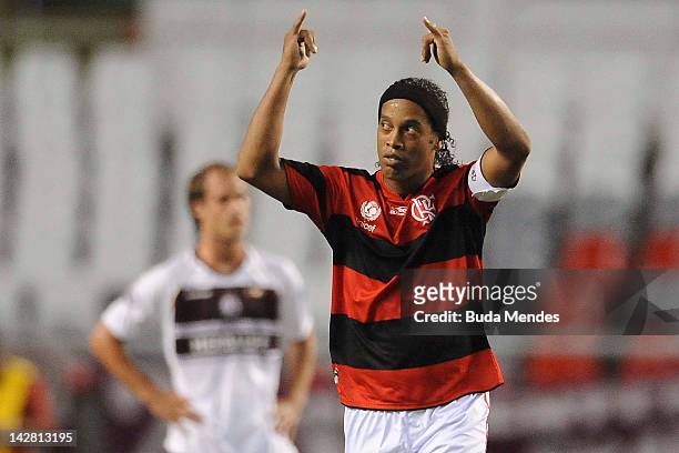 Ronaldinho of Flamengo celebrates a scored goal of Luis Antonio againist Lanus during a match between Flamengo and Lanus as part of the Copa...