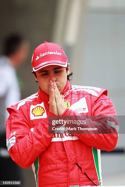 Felipe Massa of Brazil and Ferrari attends the Ferrari team group photo opportunity before the start of practice for the Chinese Formula One Grand...