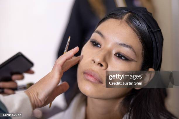 Model prepares for the runway in the backstage prior to the Vaillant Womenswear Spring/Summer 2023 show as part of Paris Fashion Week on September...