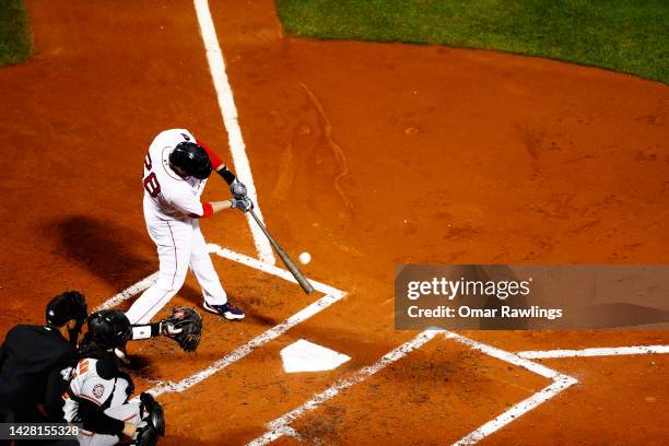 Martinez of the Boston Red Sox hits a single in the bottom of the second inning of the game against the Baltimore Orioles at Fenway Park on September...