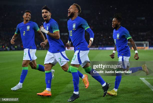 Neymar of Brazil celebrates after scoring their sides third goal with Fred, Lucas Paqueta and Danilo of Brazil during the International Friendly...