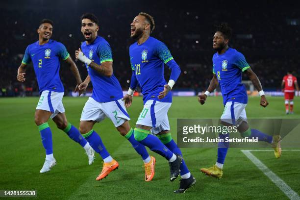 Neymar of Brazil celebrates after scoring their sides third goal with Fred, Lucas Paqueta and Danilo of Brazil during the International Friendly...