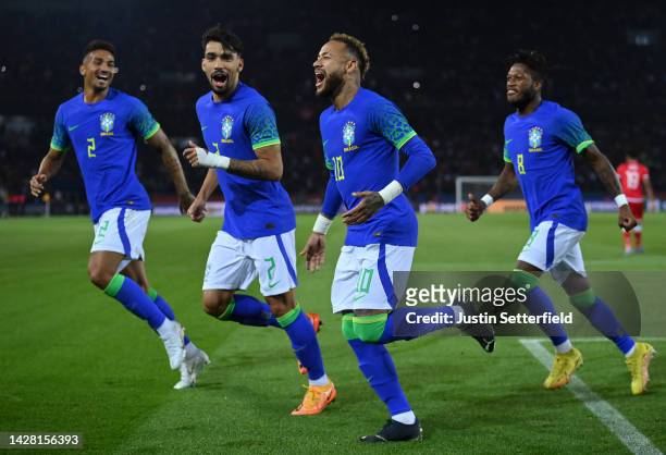 Neymar of Brazil celebrates after scoring their sides third goal with Fred, Lucas Paqueta and Danilo of Brazil during the International Friendly...