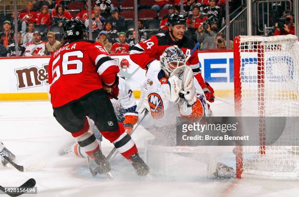 Erik Haula of the New Jersey Devils scores a second period goal against Cory Schneider of the New York Islanders at the Prudential Center on...
