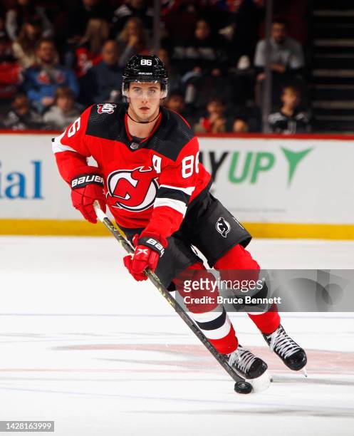 Jack Hughes of the New Jersey Devils skates against the New York Islanders at the Prudential Center on September 27, 2022 in Newark, New Jersey.