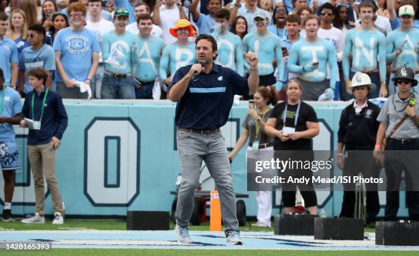 Jeff Saturday, a former North Carolina player and current NFL broadcaster, hypes up the crowd before a game between Notre Dame and North Carolina at...