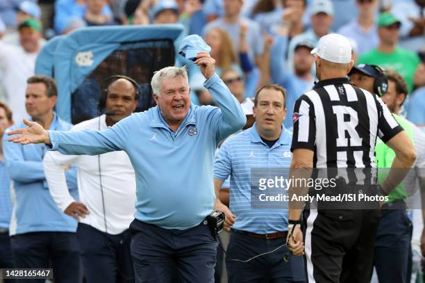 Head coach Mack Brown of the University North Carolina yells at Referee Jeff Flanagan after his team was called for a penalty while defending a...