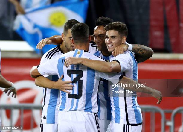 Julian Alvarez of Argentina is congratulated by teammates Nicolas Tagliafico,Giovani Lo Celso and Lautaro Martinez after Alvarez scored a goal in the...