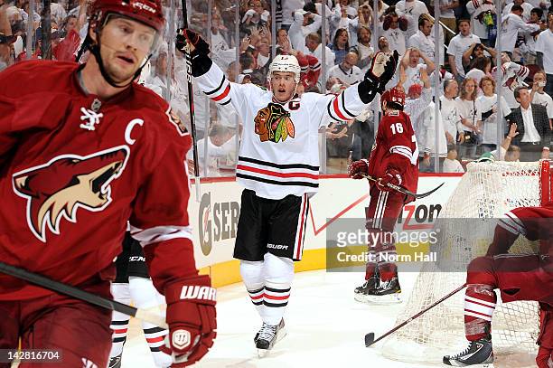 Jonathan Toews of the Chicago Blackhawks celebrates after his team scores the game-tying goal against the Phoenix Coyotes in Game One of the Western...