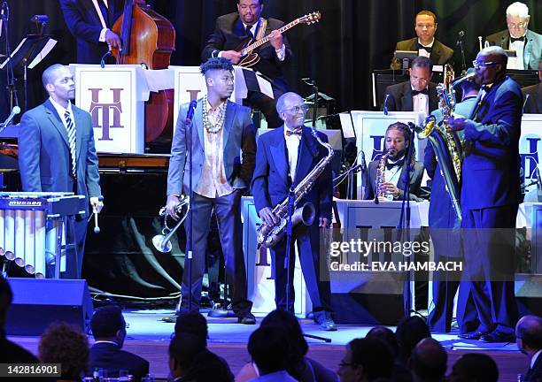 Vibraphonist Warren Wolf, trumpet player Christian Scott, tenor saxophonist Jimmy Heath and alto saxophonist Brent Birckhead listen to Davey...