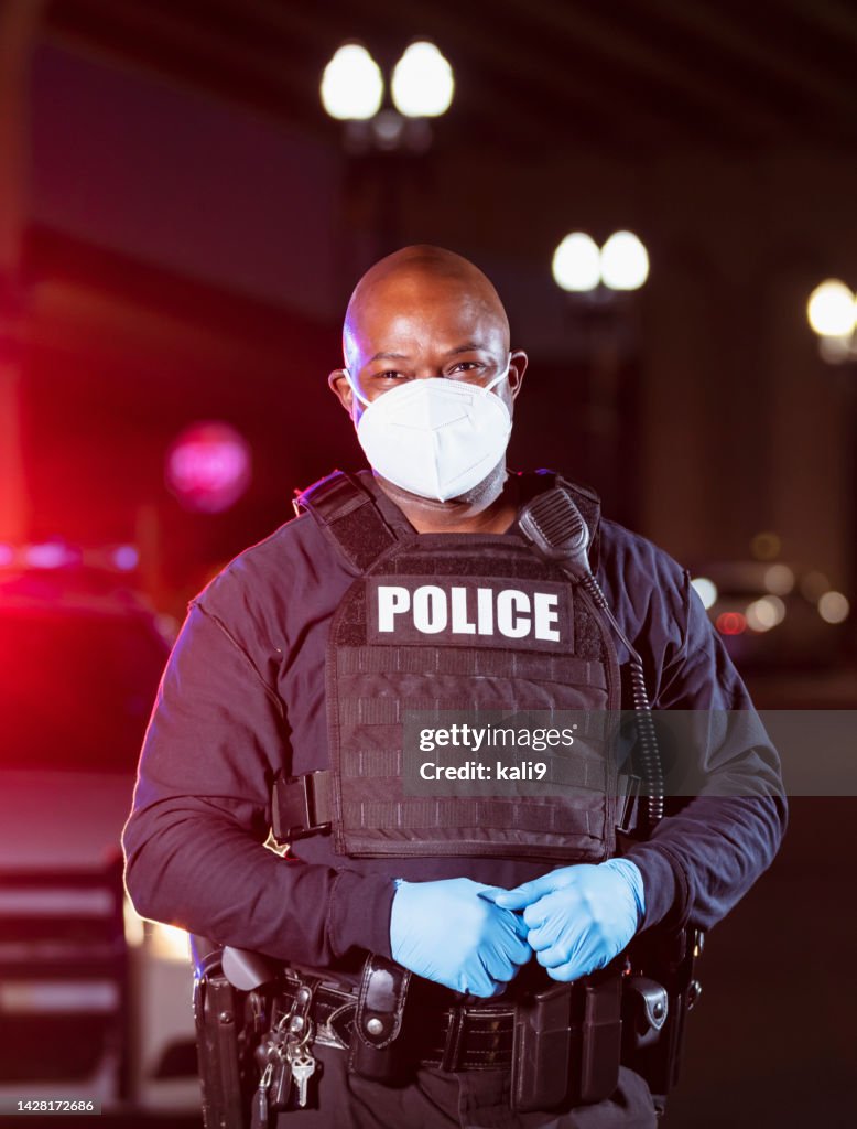 Police Mask Colour In Africanamerican Police Officer At Night With Face Mask High-Res Stock ...
