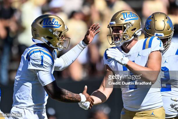 Wide receiver Colson Yankoff of the UCLA Bruins celebrates with quarterback Dorian Thompson-Robinson after a third quarter touchwon against the...