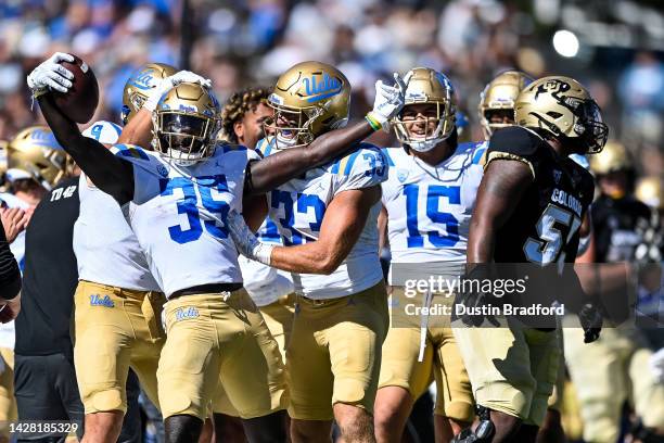 Linebacker Carl Jones Jr. #35 of the UCLA Bruins celebrates after intercepting a pass against the Colorado Buffaloes in the third quarter of a game...