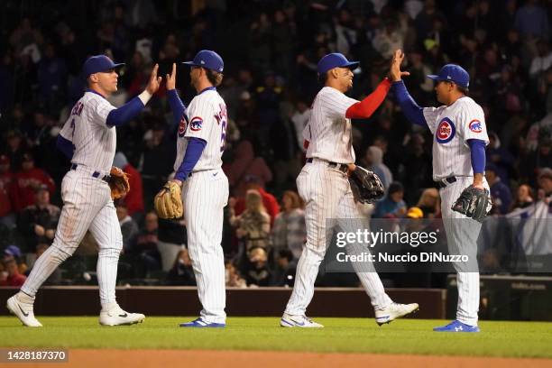 The Chicago Cubs celebrate their team win over the Philadelphia Phillies at Wrigley Field on September 27, 2022 in Chicago, Illinois. The Cubs...
