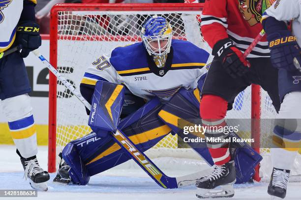 Jordan Binnington of the St. Louis Blues tends the goal against the Chicago Blackhawks during the second period of a preseason game at United Center...