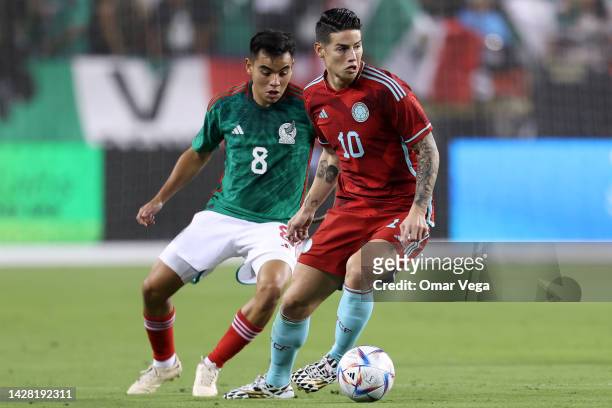 James Rodríguez of Colombia and Carlos Rodriguez of Mexico battle for the ball during the friendly match between Mexico and Colombia at Levi's...
