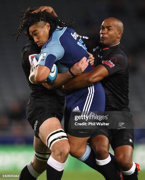 Ma'a Nonu of the Blues is tackled by JP Pietersen of the Sharks during the round eight Super Rugby match between the Blues and the Sharks at Eden...