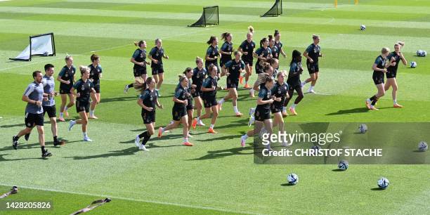Players of Germany's women's national football team jog during a training session at the team's preparation camp in Herzogenaurach, southern Germany,...